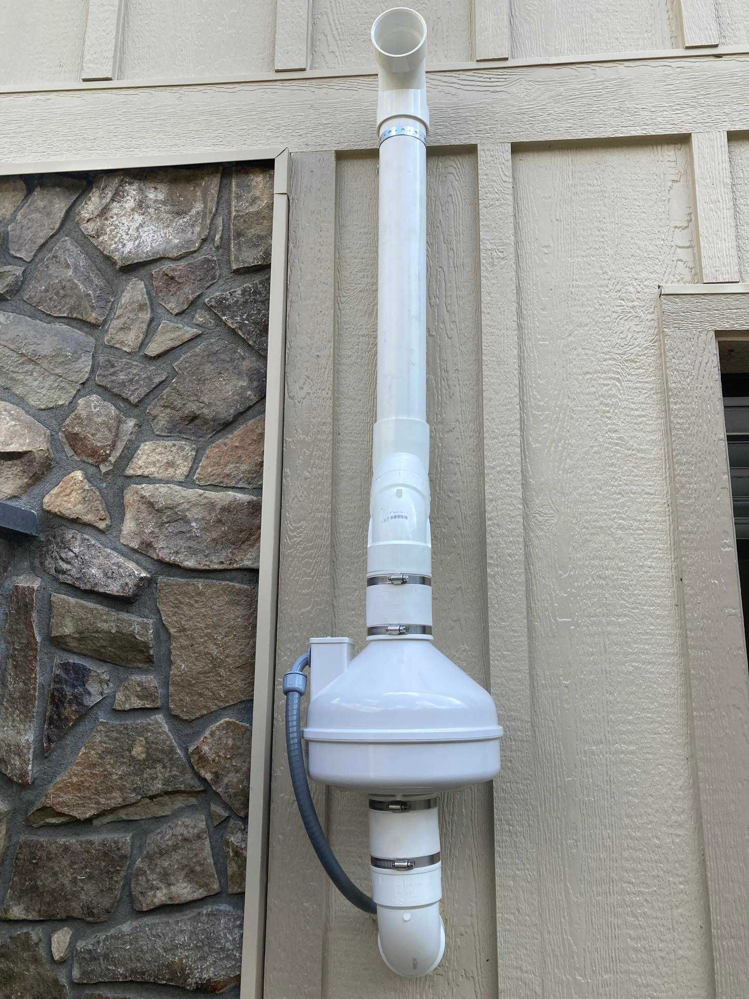 radon mitigation system installed on outside wall of boone nc home