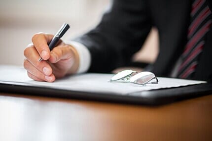 Attorney Writing A Document — Attorneys at law based in Rock Island, IL