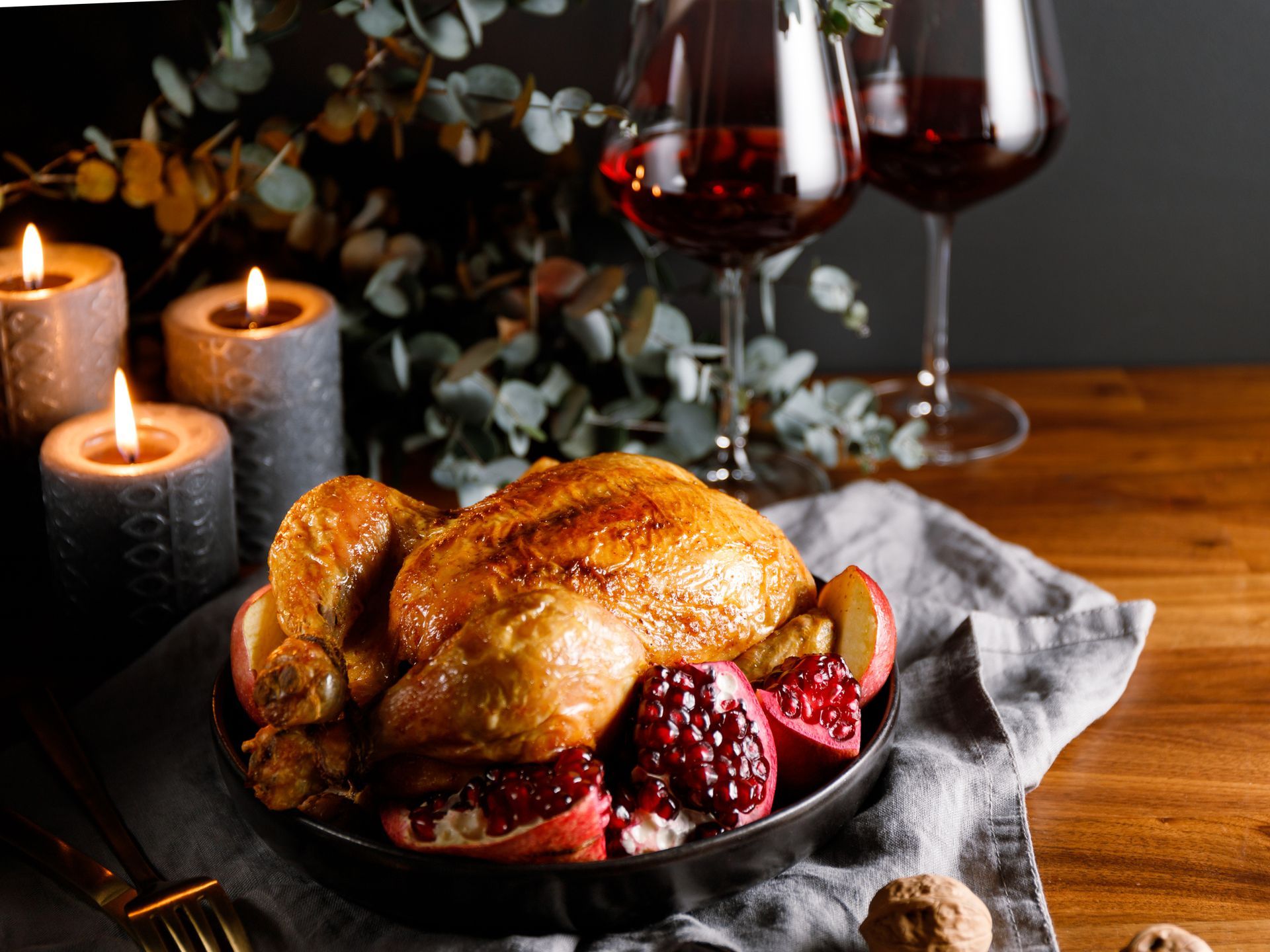 Thanksgiving table: Roasted turkey, side dishes, pumpkin, and pie.