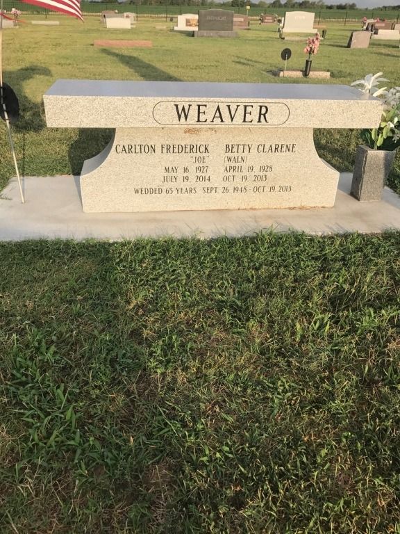 A grave of a person named weaver in a cemetery.