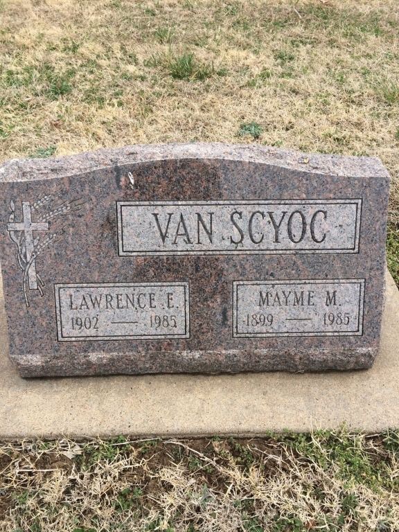 A gravestone for van scyoc and lawrence e. mayme m. in a cemetery.