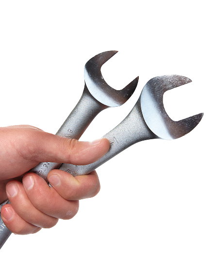 Hand holding two wrenches | King's Auto LLC