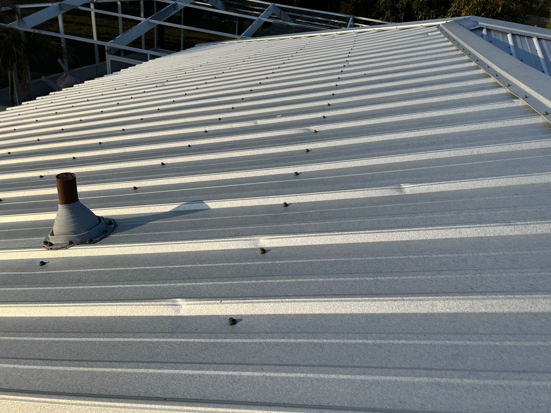 A close up of a roof with a chimney on it