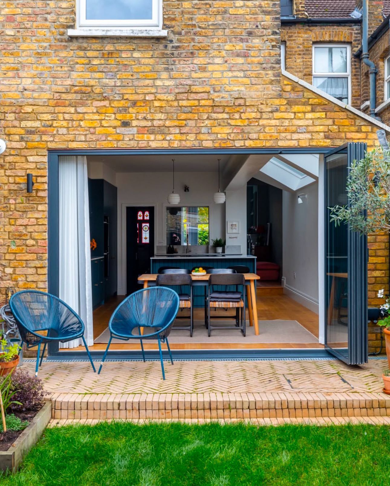 A living room with a fireplace and a sliding glass door.