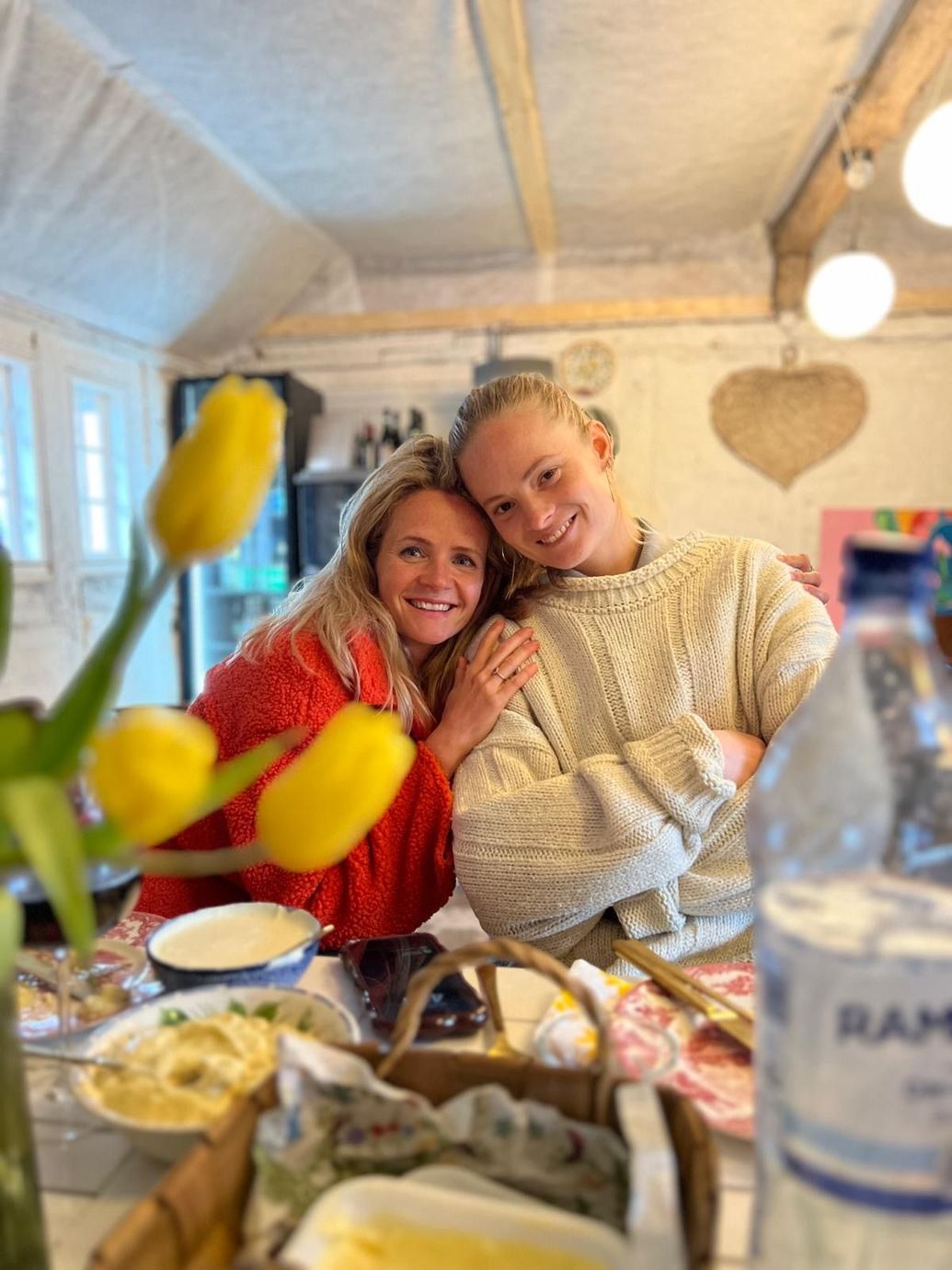 Two glasses of wine and nice snacks by the fireplace at Solbjerggaard—luxurious, cosy moments in the Danish countryside.