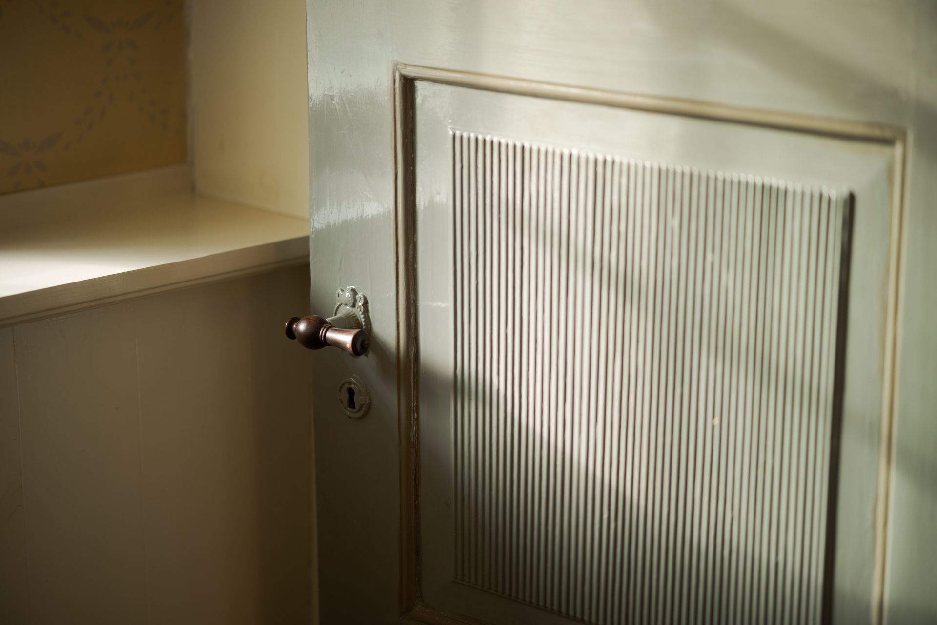 A close up of a door with a striped pattern on it.
