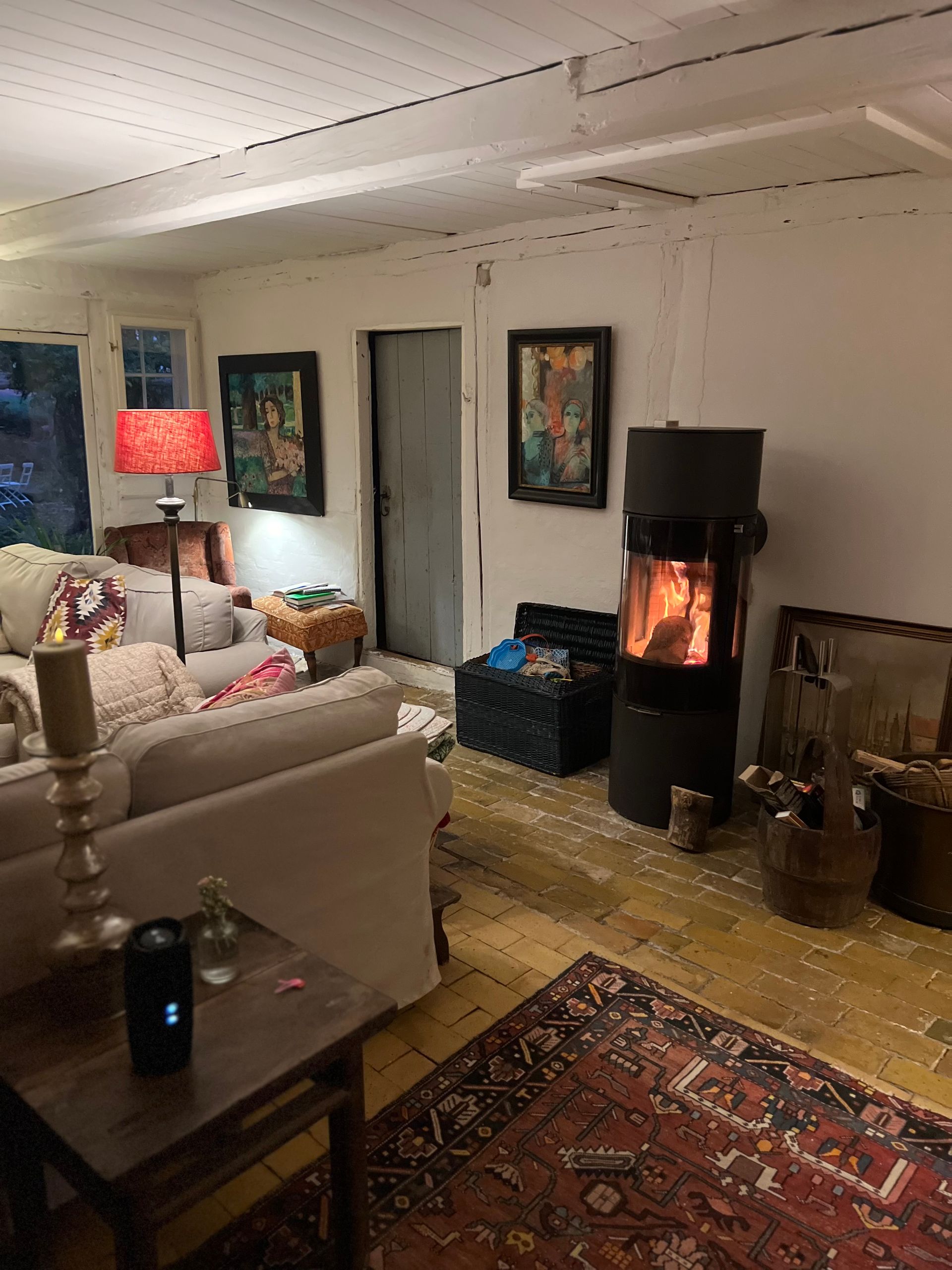 A living room filled with furniture and a fireplace.