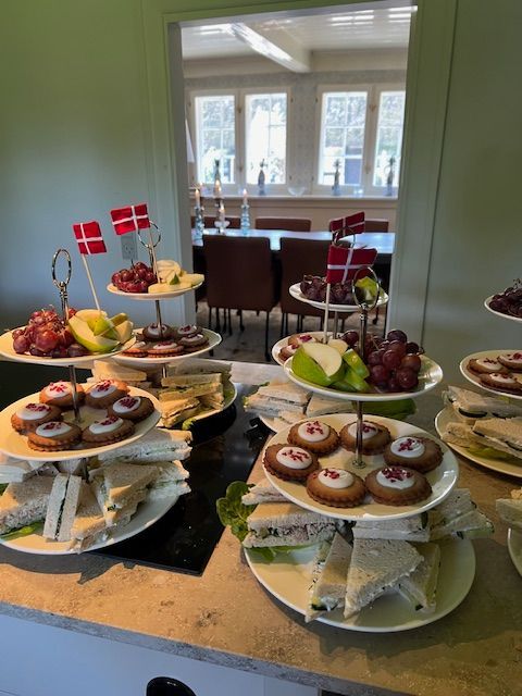 A table with a bunch of plates of food on it