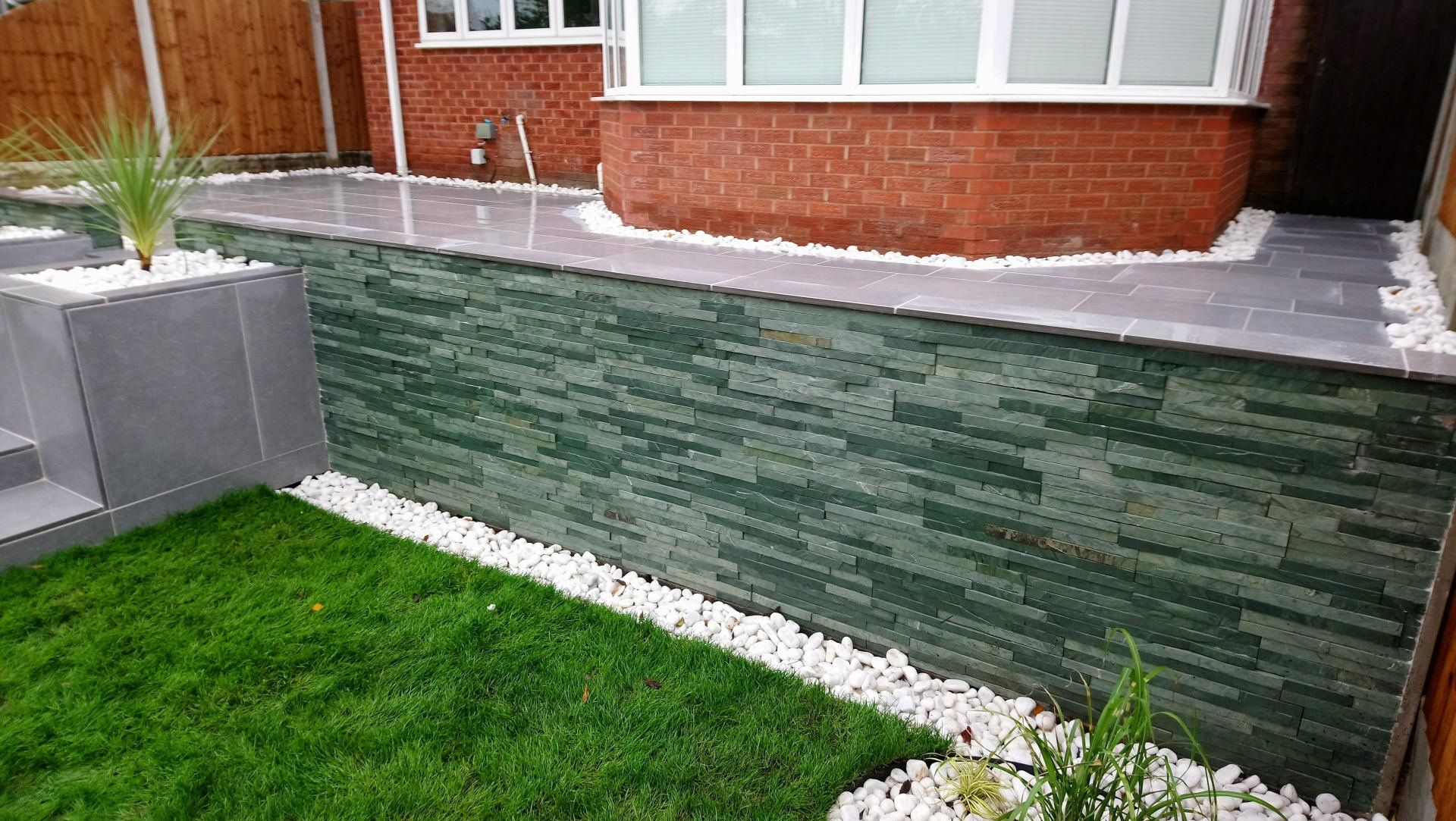 Walled garden with white stone edging