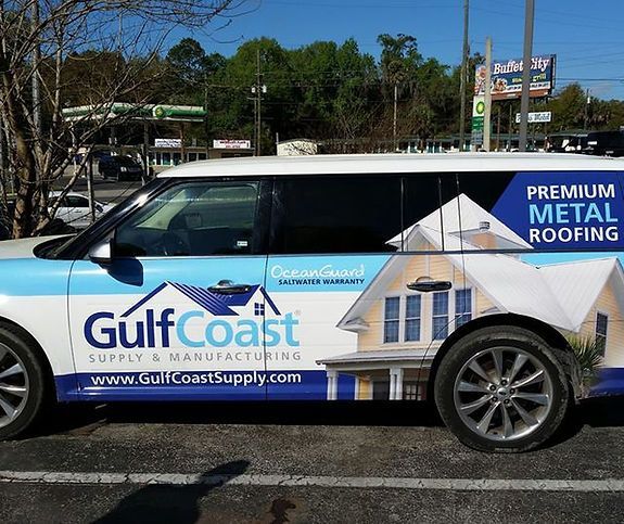 A gulf coast van is parked in a parking lot