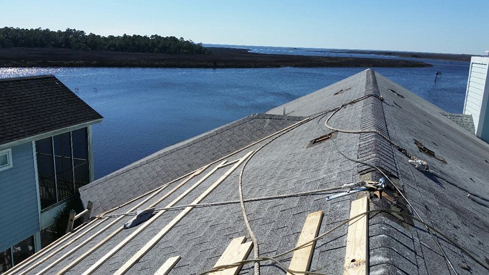 A roof with a view of a body of water