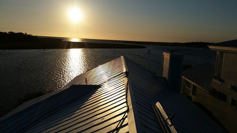 The sun is setting over a body of water