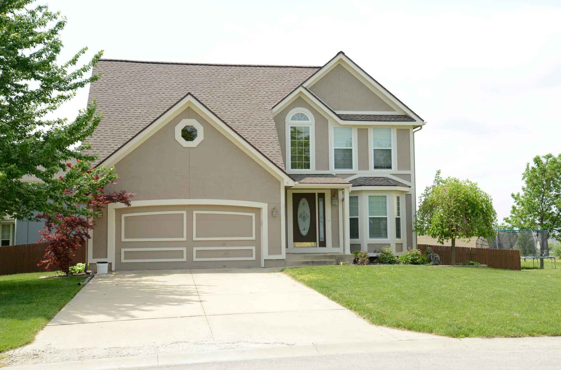 House with Two Car Garage with a Concrete Driveway — Rockford, IL — Northern Illinois Concrete Lifting