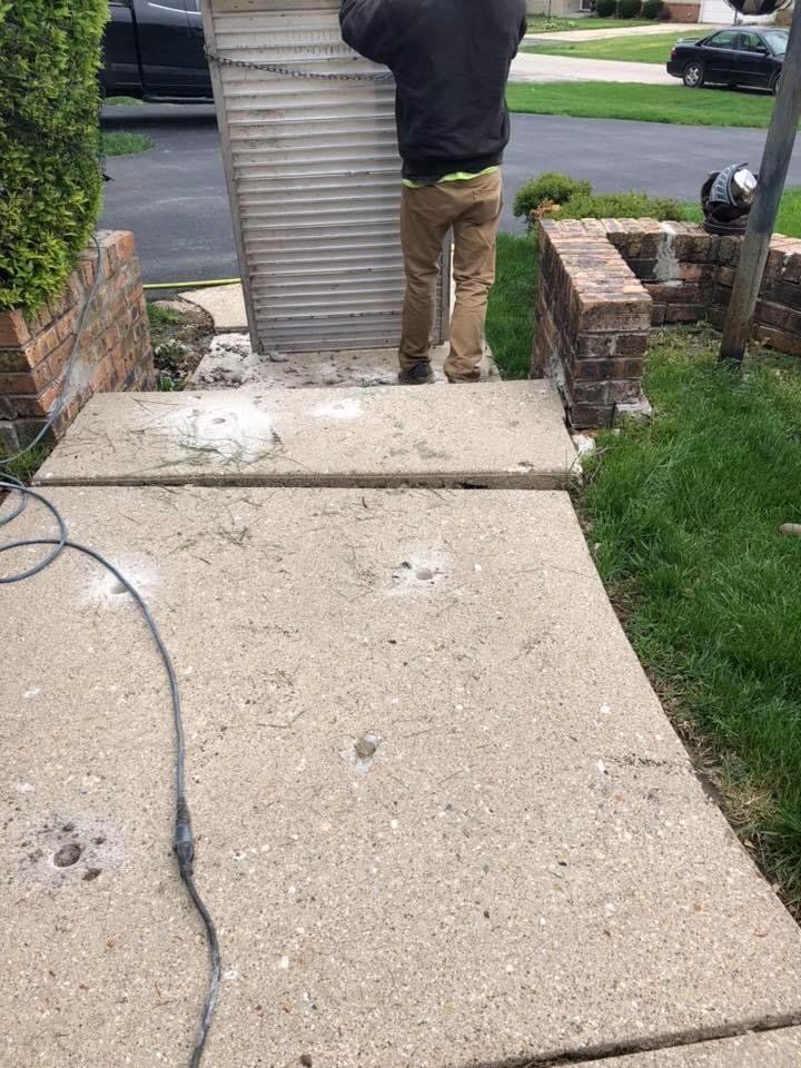 Man Working on the Sidewalk — Rockford, IL — Northern Illinois Concrete Lifting