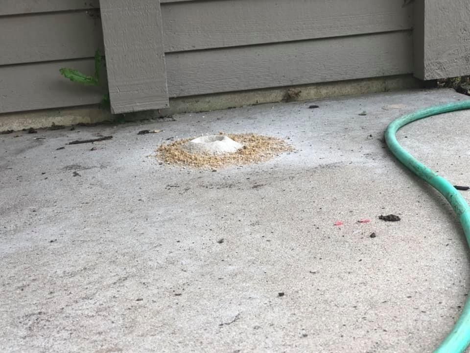 Concrete Floor and Green Hose — Rockford, IL — Northern Illinois Concrete Lifting