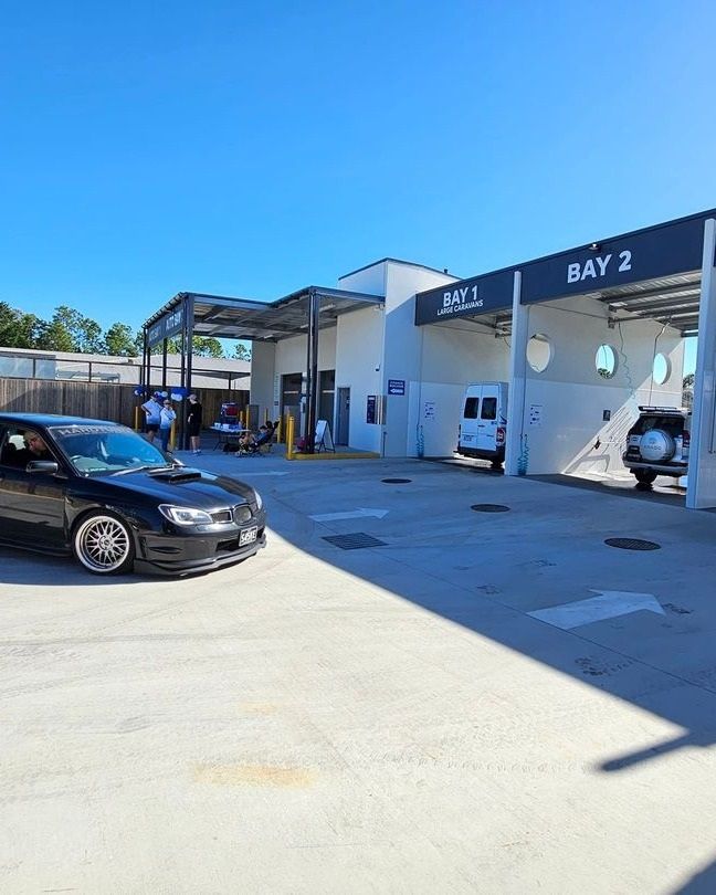 A Black Car Is Parked In Front Of A Car Wash — Carwash 44 In Caboolture, QLD