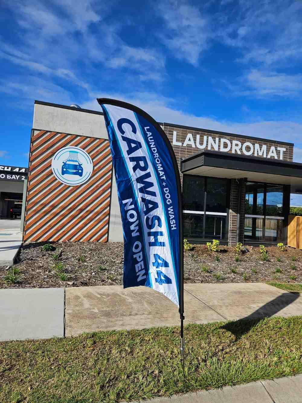A Car Wash Is Now Open With A Flag In Front Of It — Carwash 44 In Caboolture, QLD
