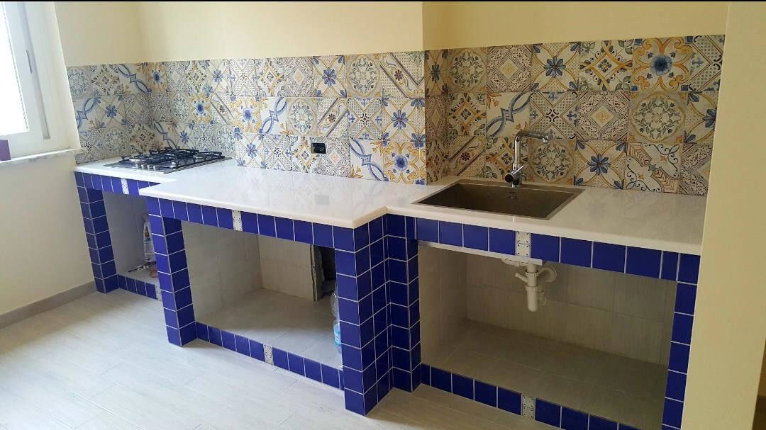 cucina industriale con forni in acciaio inox