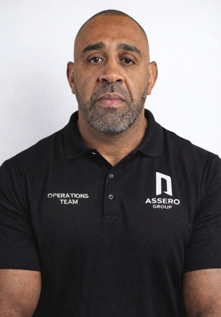 A person with a beard wearing a black