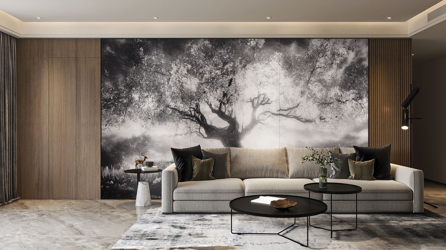 Soggiorno con un grande murale raffigurante un albero in bianco e nero, un divano grigio, due tavolini neri e pannelli in legno.