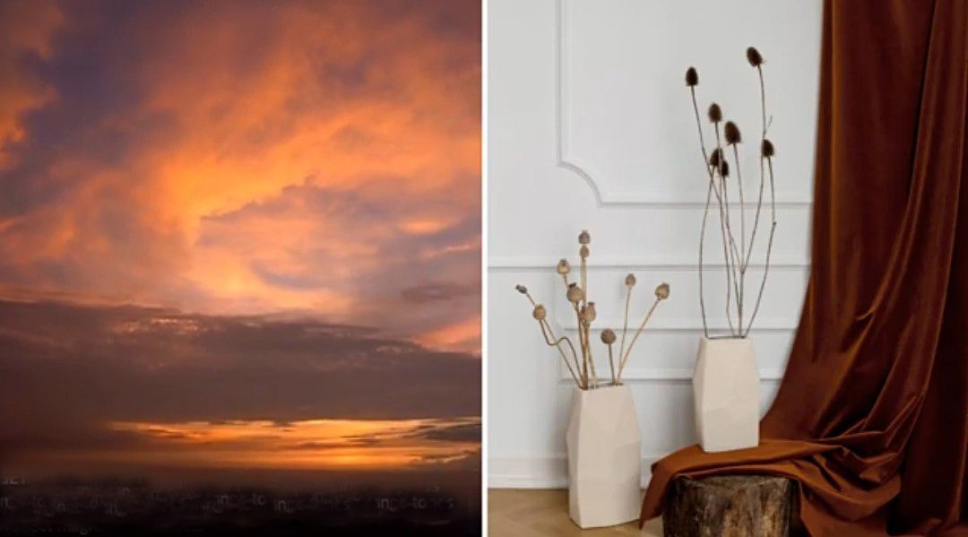 Tramonto su un orizzonte scuro; adiacente a uno studio allestito con fiori secchi in vasi e un drappo color ruggine.