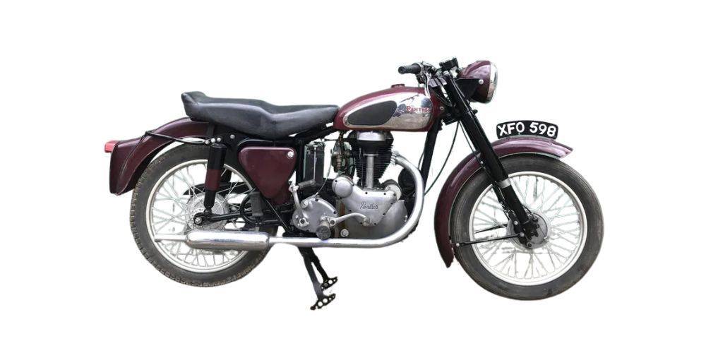 Burgundy vintage 1955 Panther Model 65 on a white background.