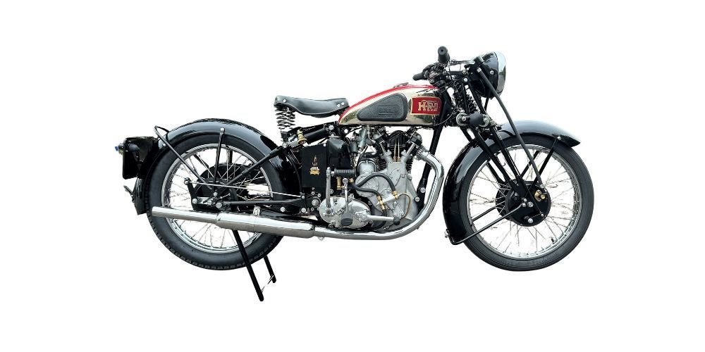 Classic black and silver motorcycle with red accents, set against a white background.