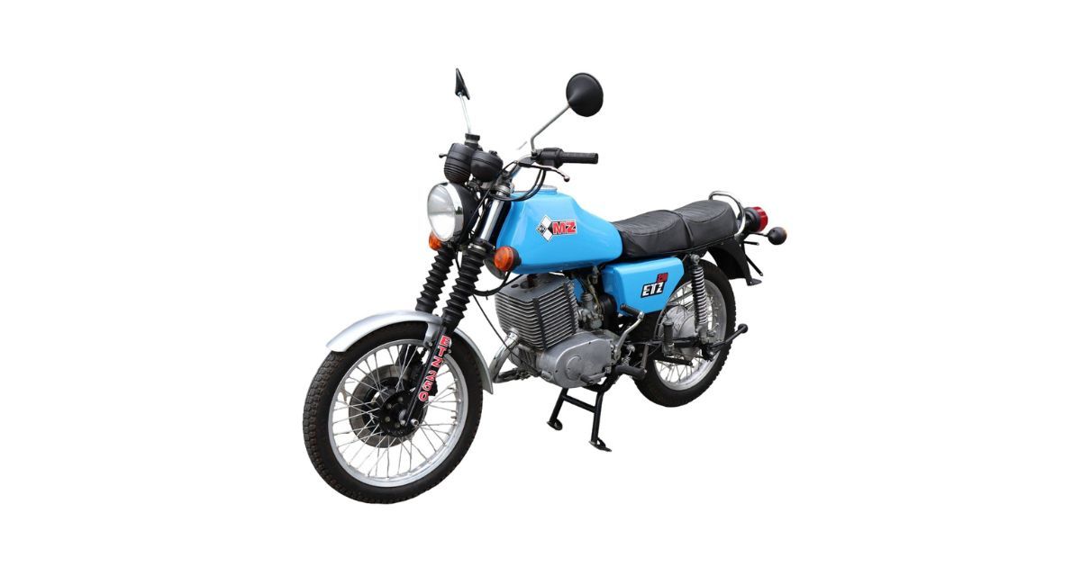 A blue motorcycle is parked on a white background.