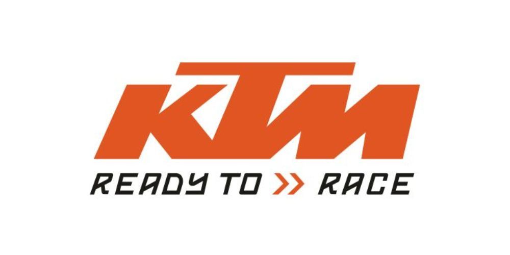 A ktm ready to race logo on a white background