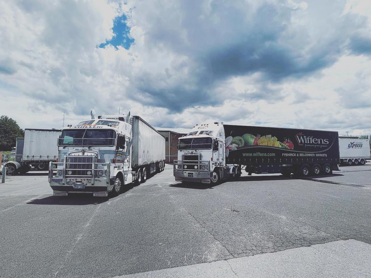 Parked Delivery Trucks at Joe Camilleri Transport — Joe Camilleri Transport in Fyshwick, ACT