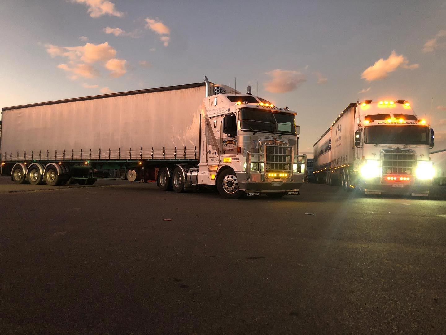 Two Large Container Trucks Crossing Road — Joe Camilleri Transport in Fyshwick, ACT