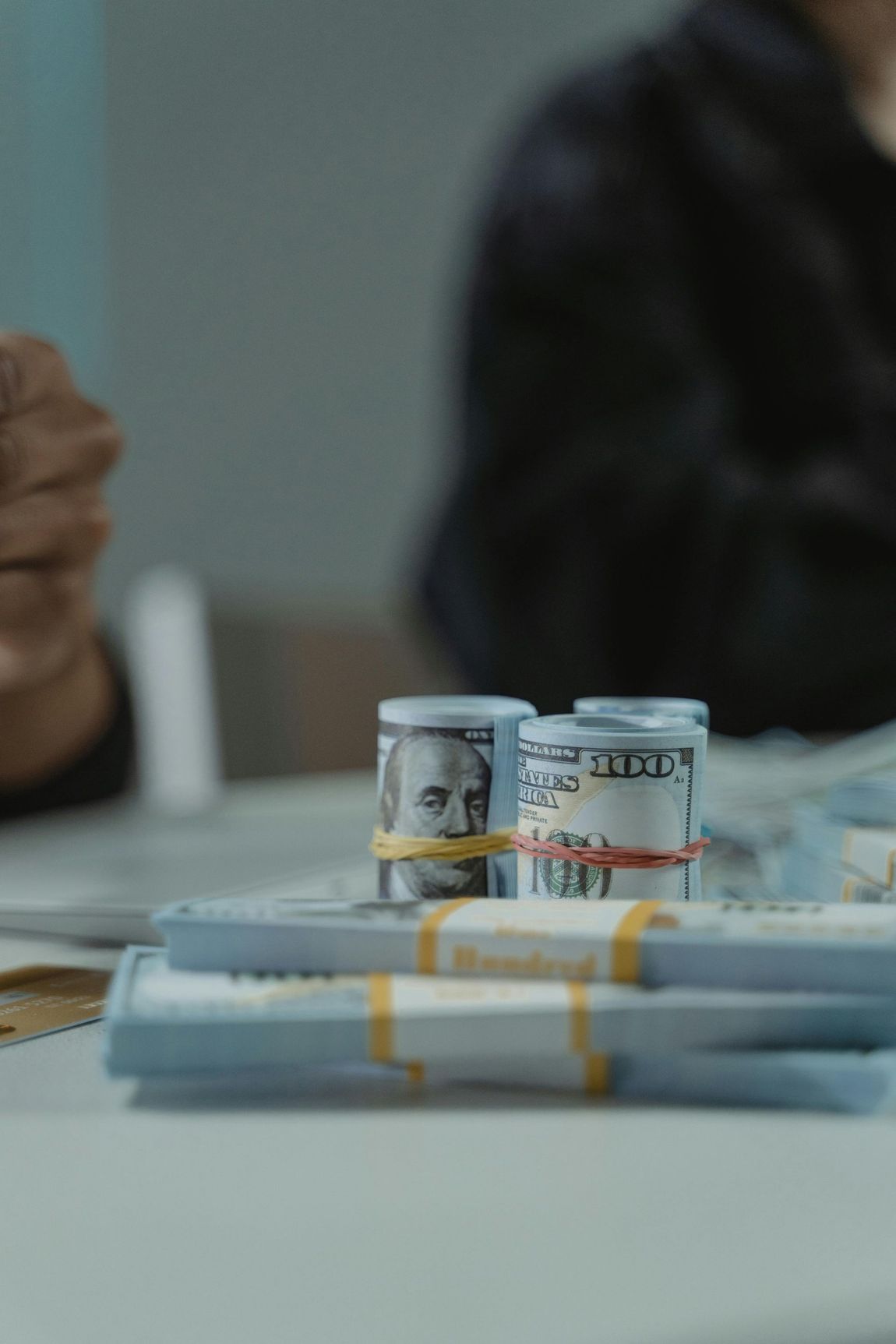 Financial professional counting mortgage funds protected by a comprehensive lender's title insurance policy.