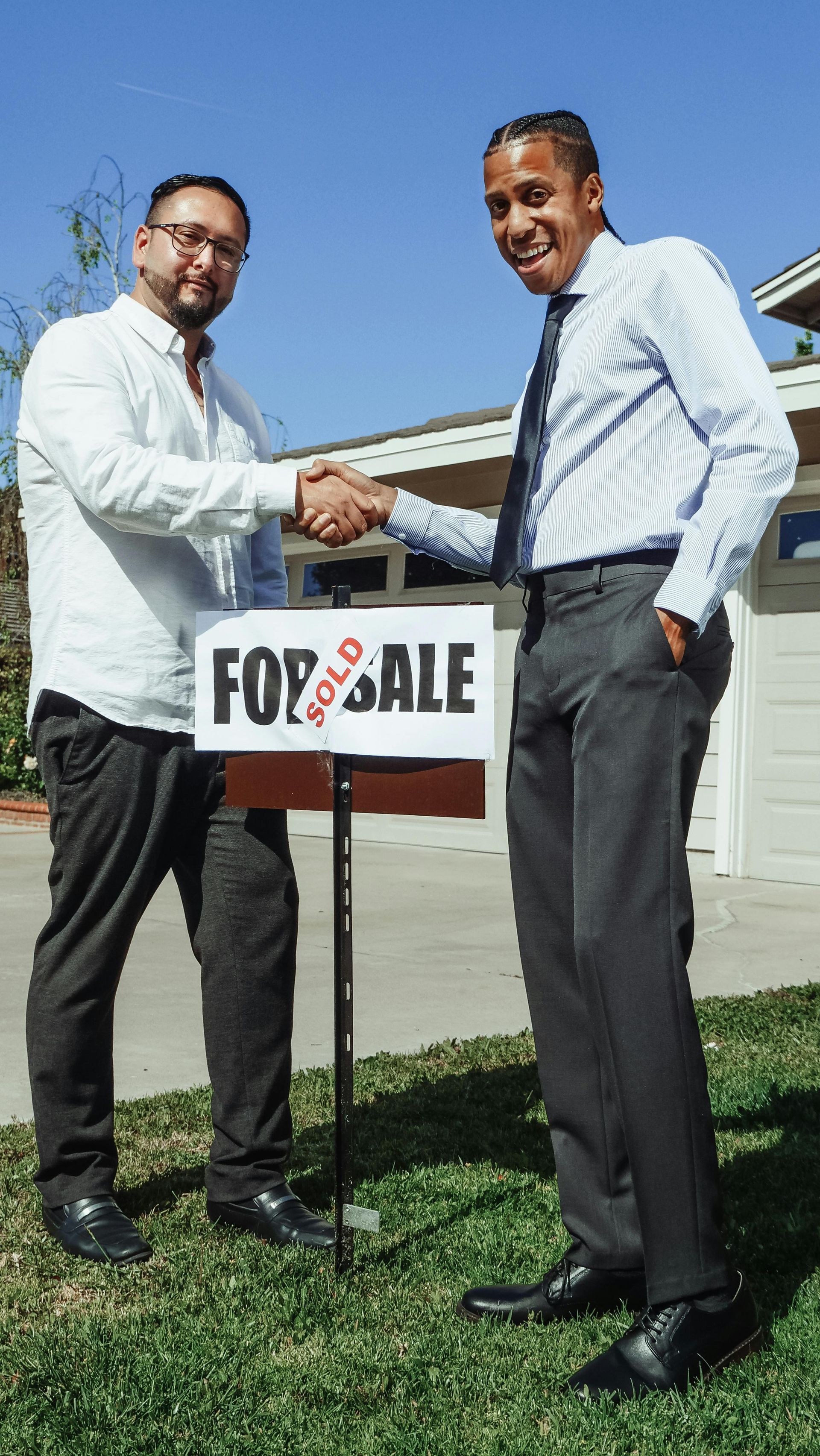 A residential for sale sign symbolizing protection against hidden property title defects and unrecorded liens.