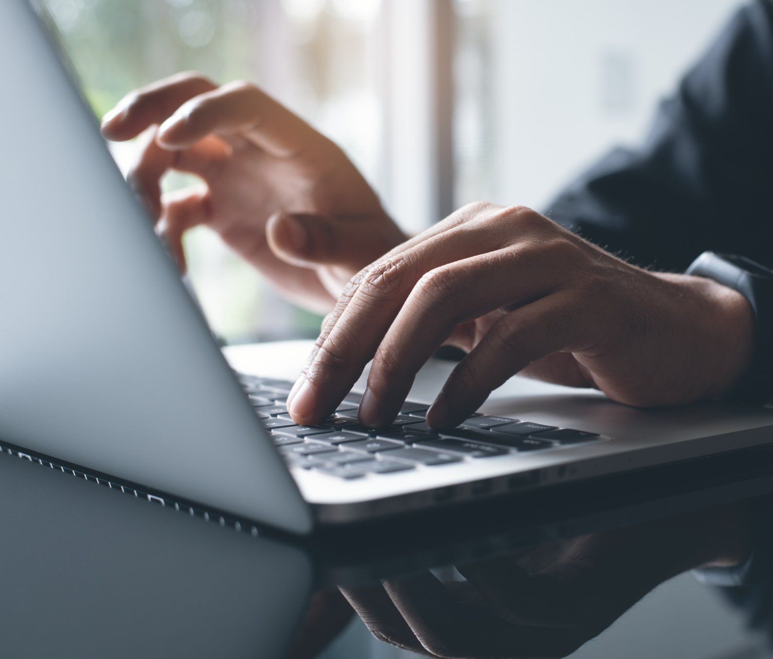 A person working on cloud-based documents using a laptop computer.