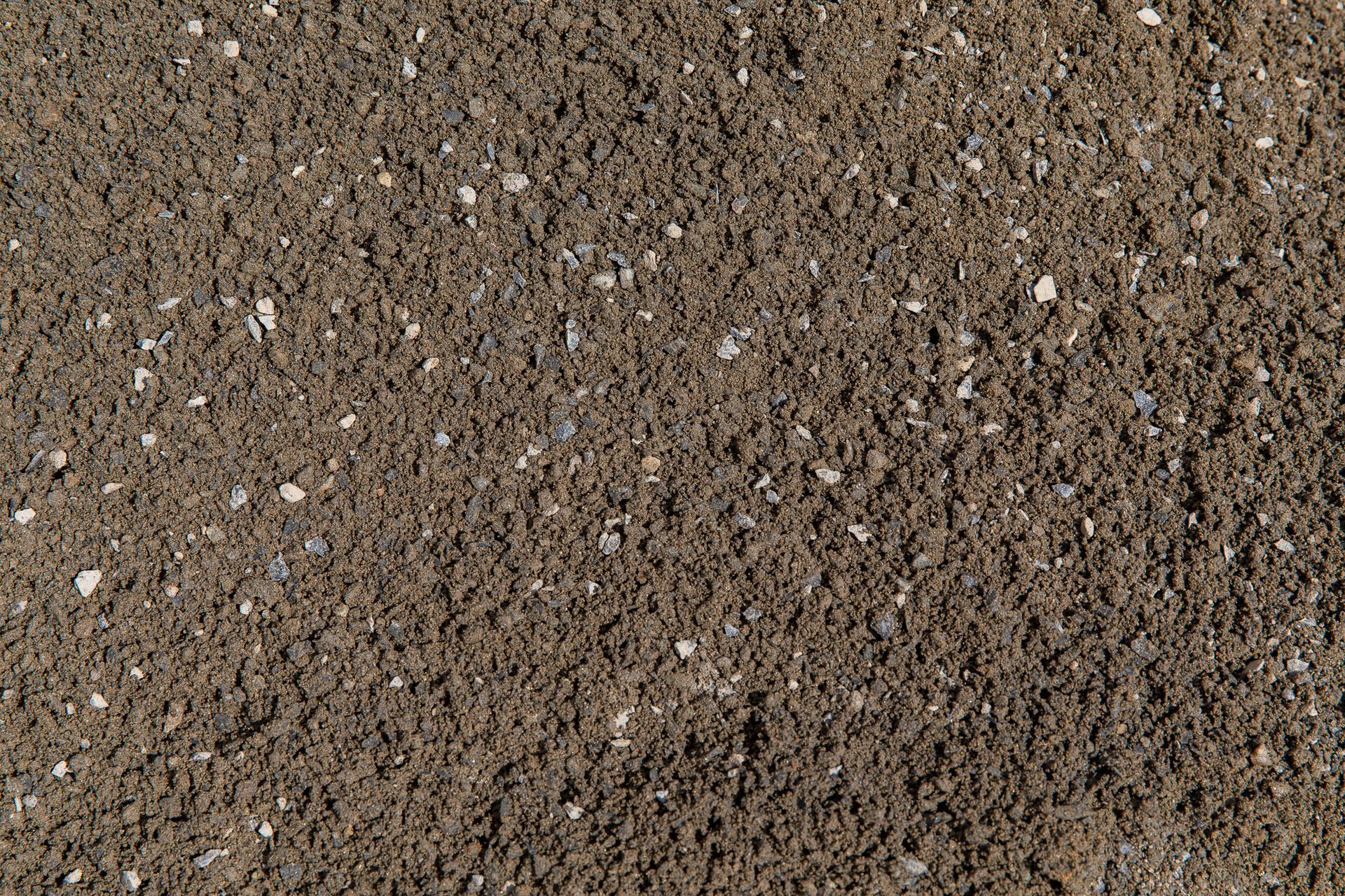 A close up of a pile of brown sand