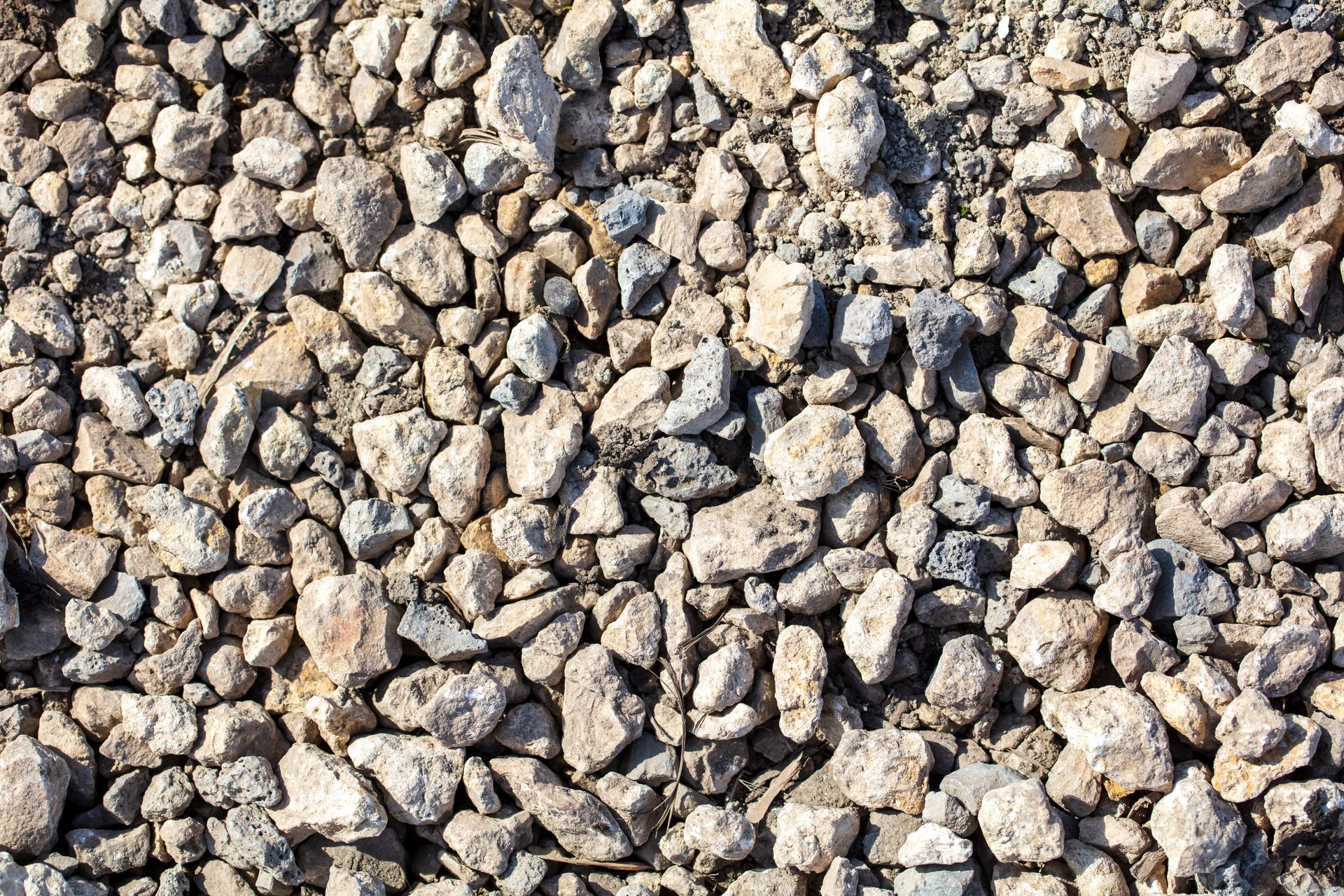 A pile of gravel is sitting on the ground.