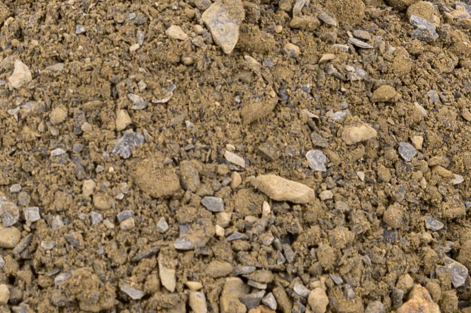 A pile of dirt and rocks is sitting on the ground.