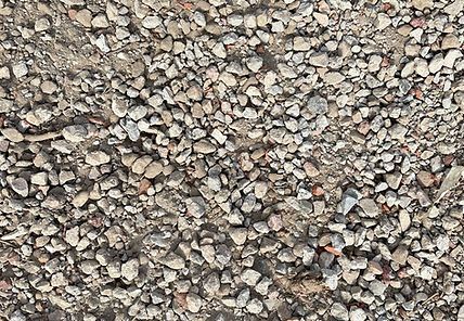 A pile of gravel is sitting on the ground.