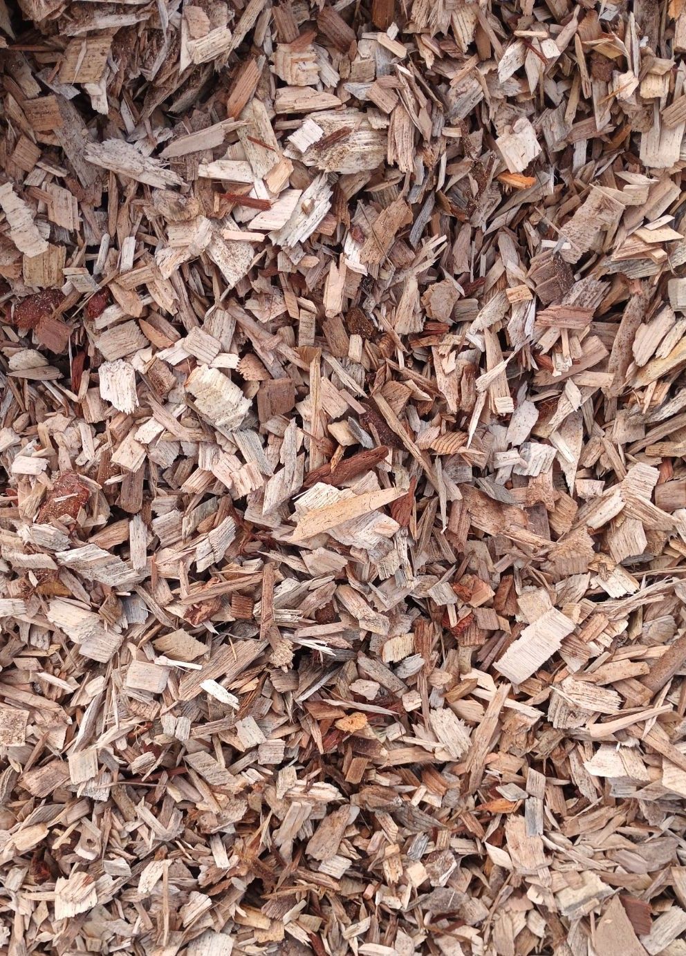 A close up of a pile of brown mulch