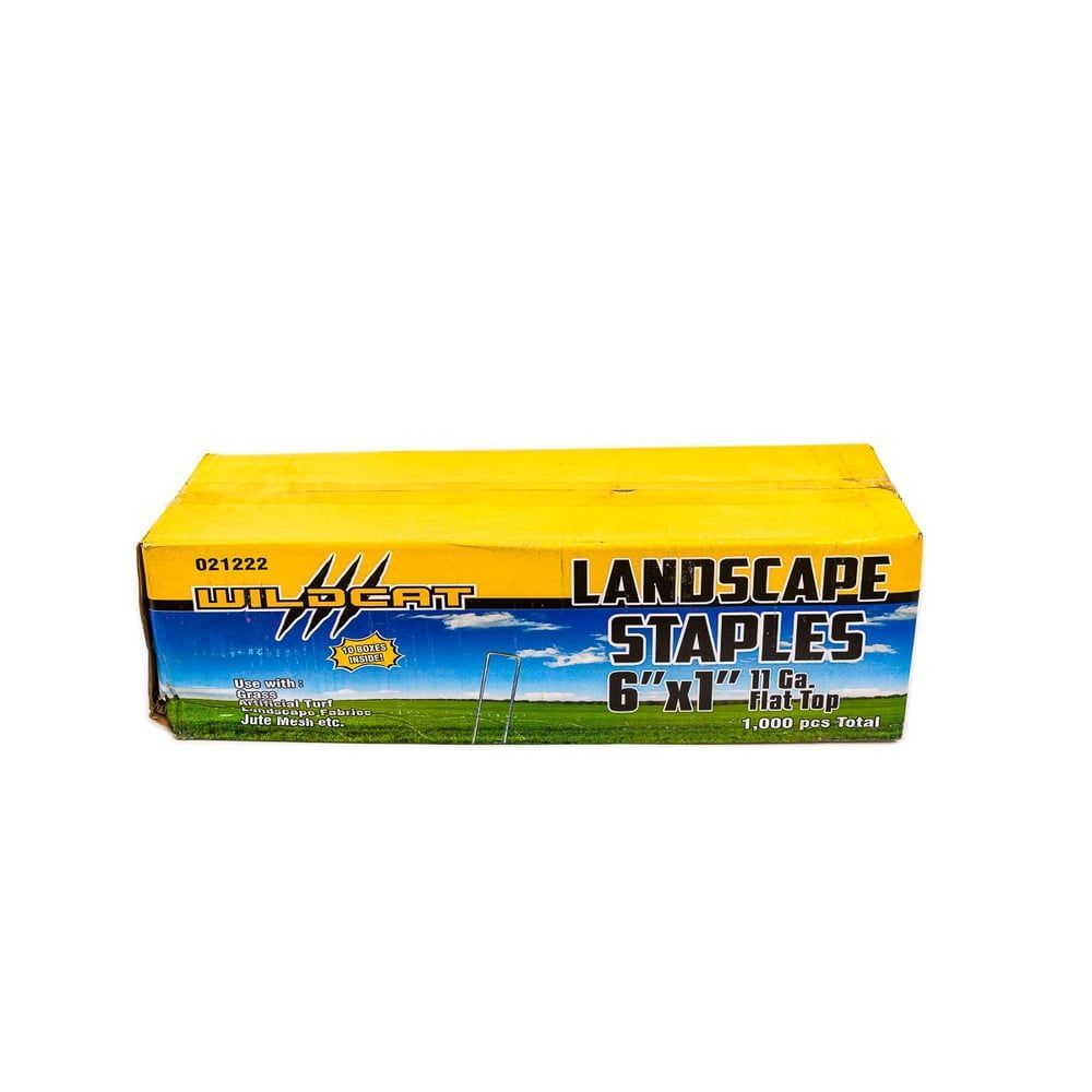 A box of landscape staples with a picture of a field