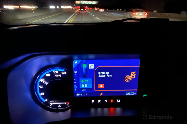 Ford Instrument Cluster With Blind Spot Warning Being Shown On Screen.