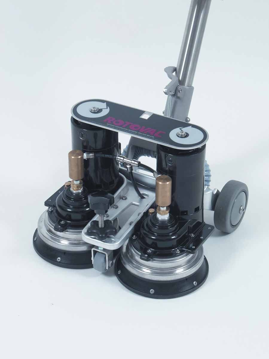 A vacuum cleaner is sitting on a white surface.