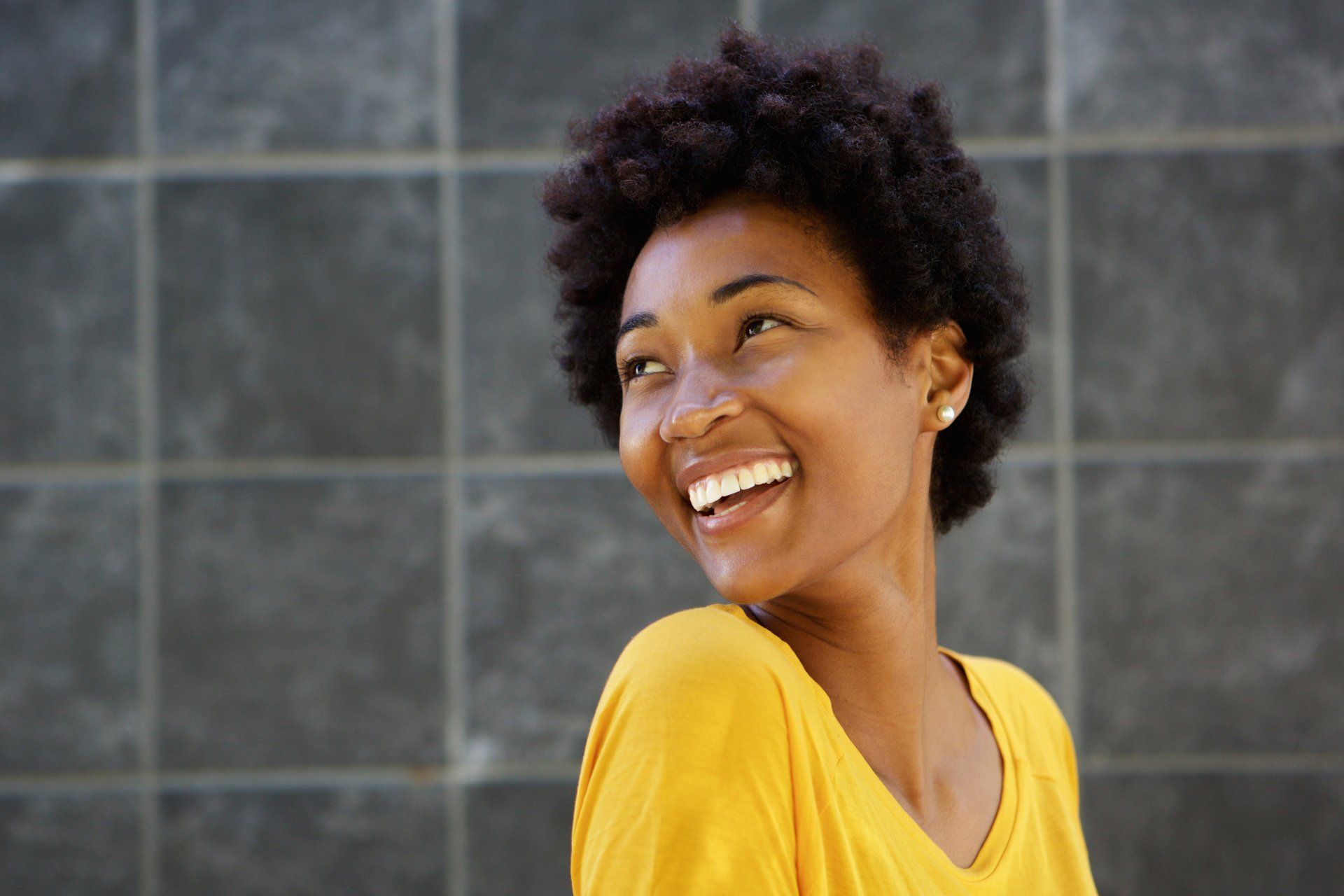 Woman looking over her shoulder smiling