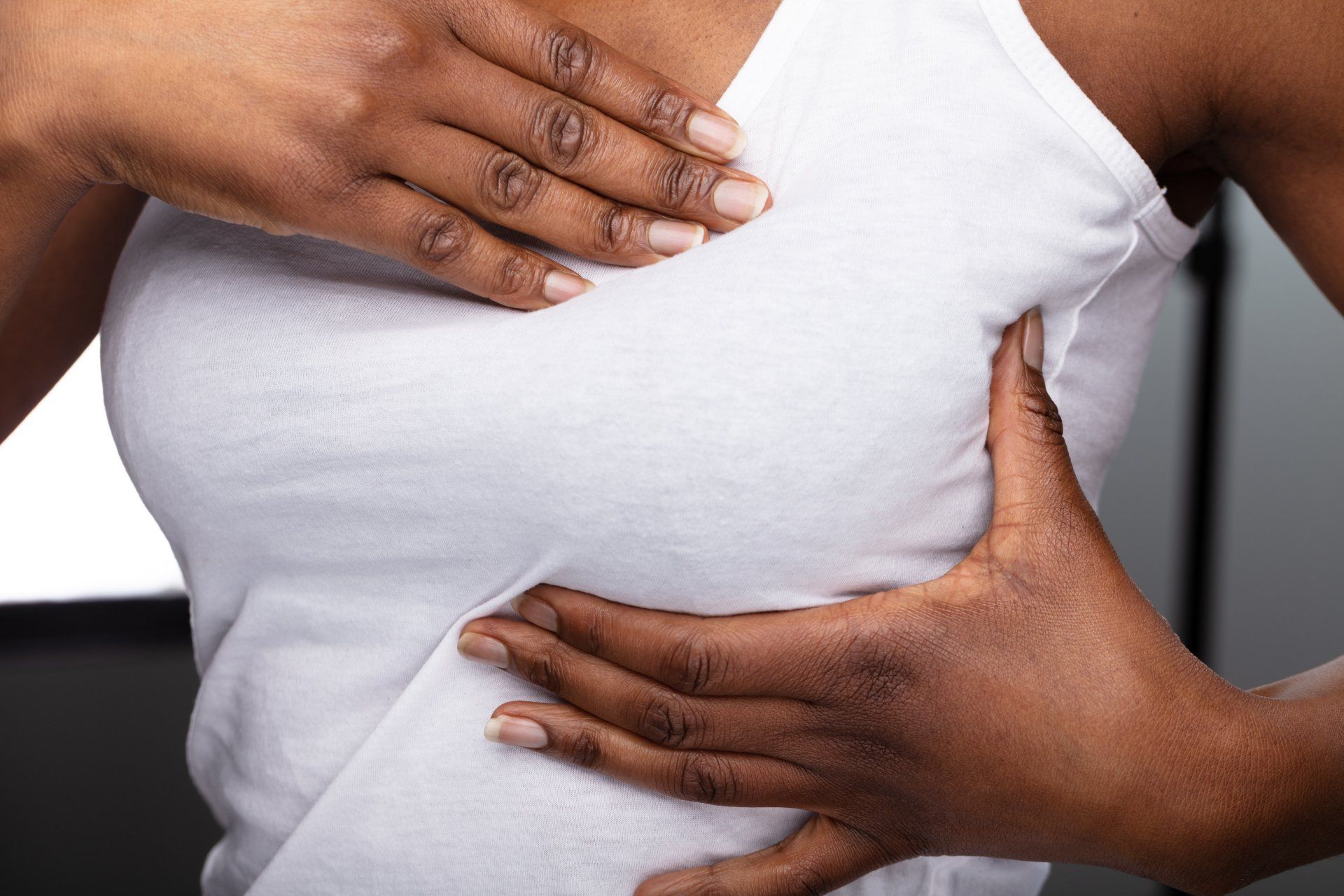 woman holding breast