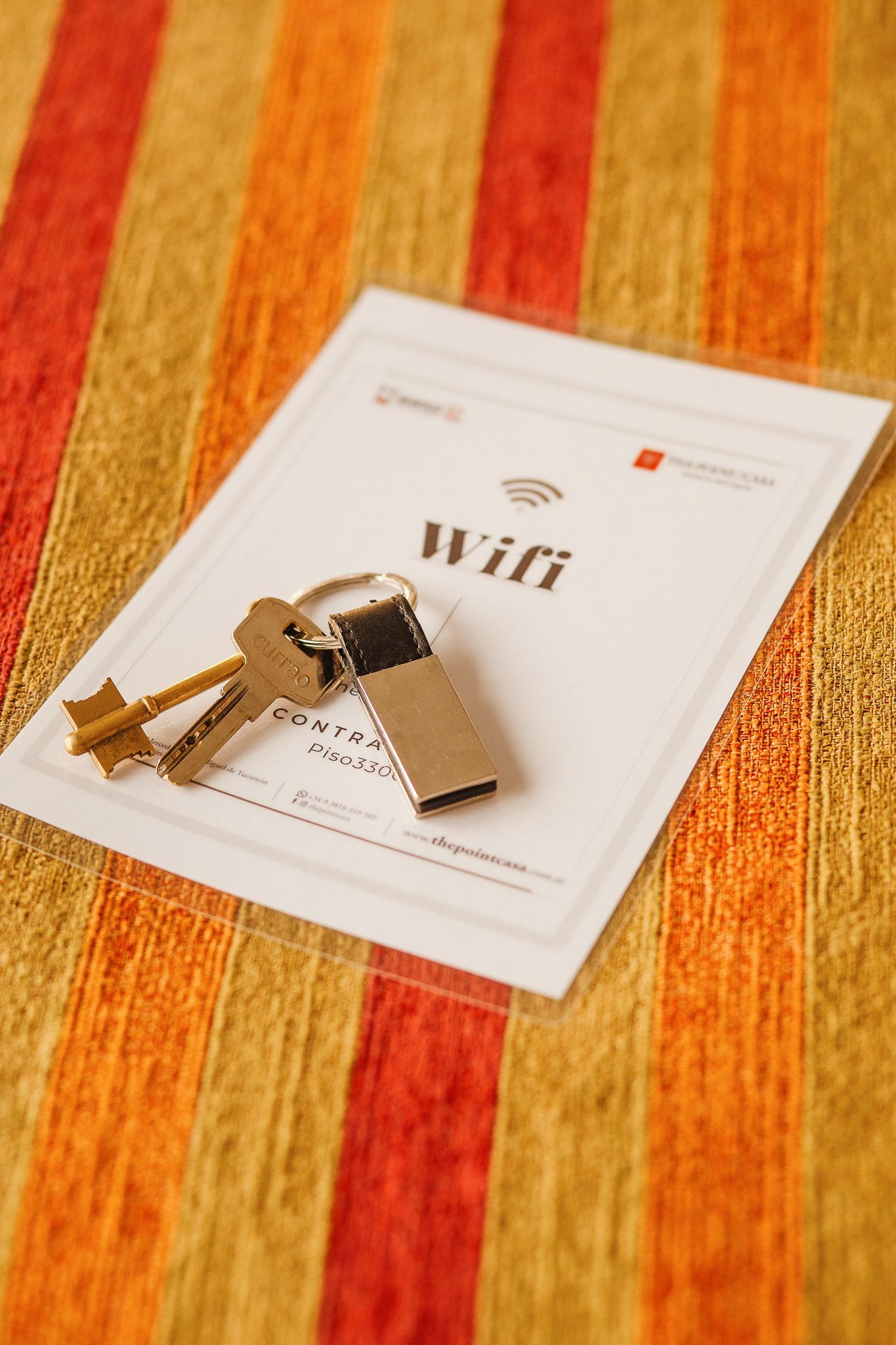Keys and a USB drive on a paper with 