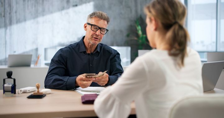 Bail Bondsman Guides Worried Female Client.