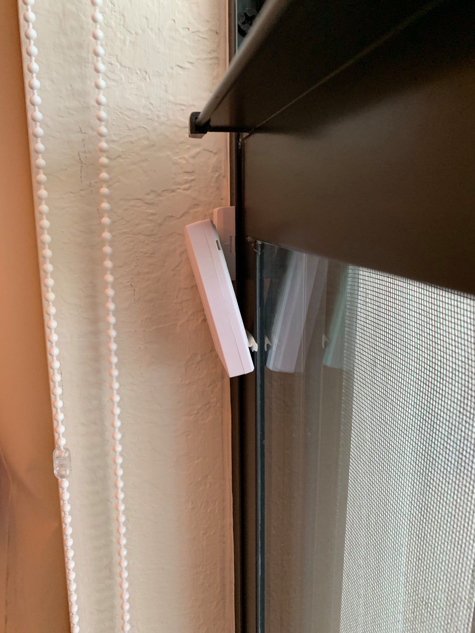 A close up of a window with blinds on it.