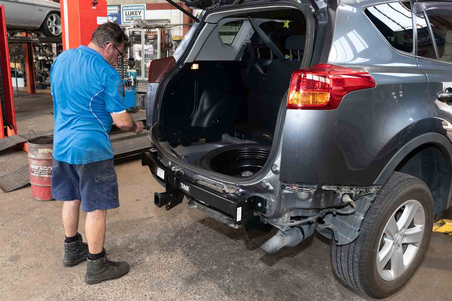 Towbar Being Installed on Car — Bob Parkes Automotive In Hyde Park, QLD