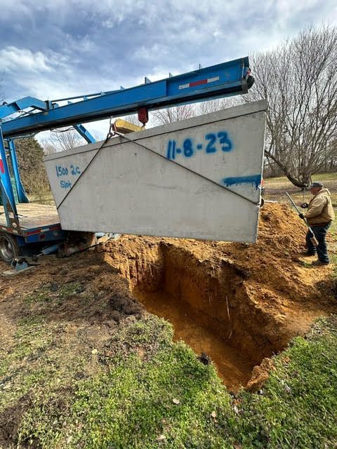 lowering concrete septic tank for installation