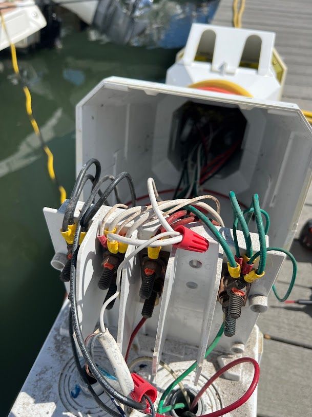 a white box with a bunch of wires coming out of it